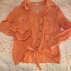 Coral button down with tie at the bottom. Size S.